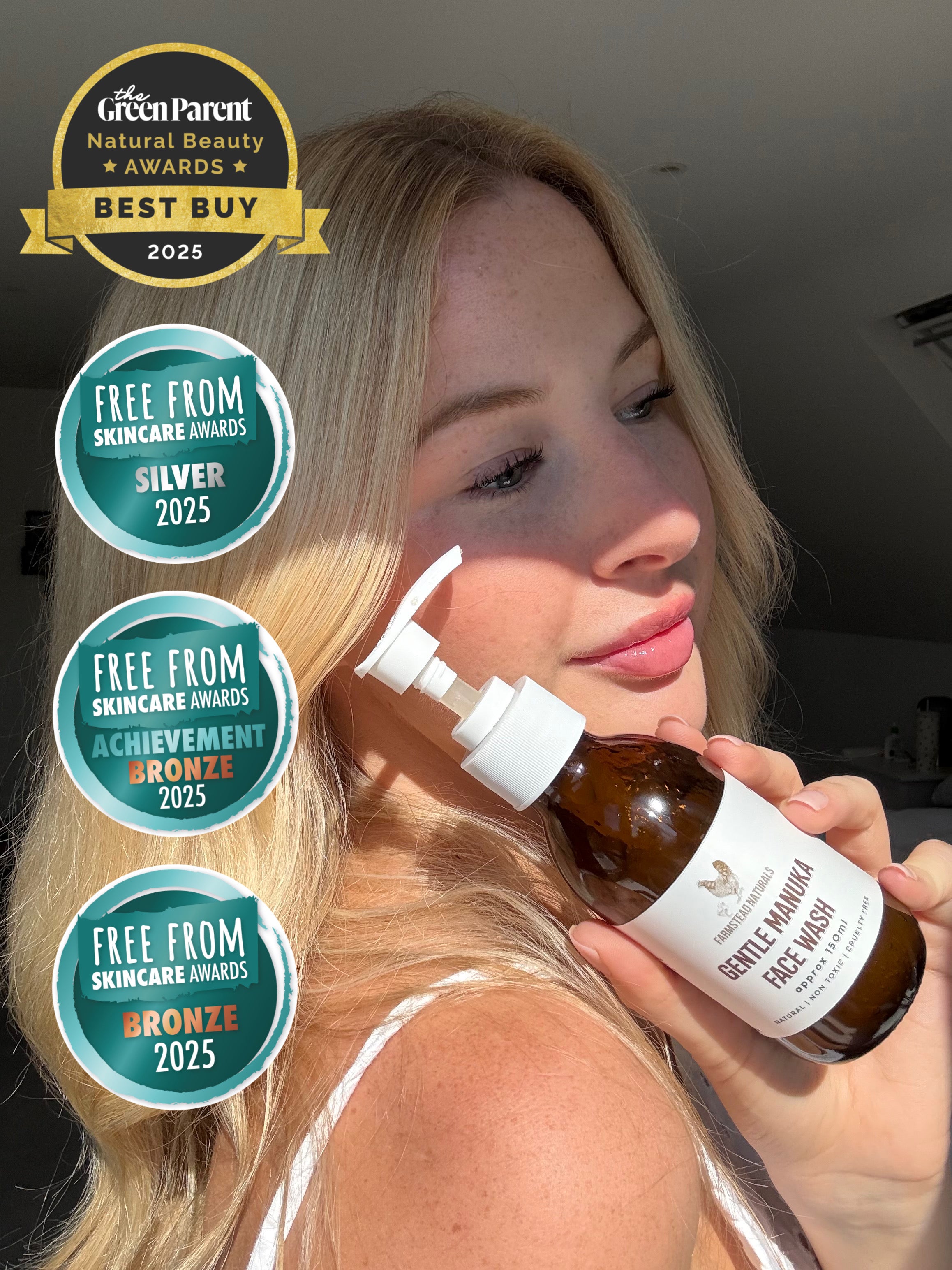 A woman holding a bottle of Farmstead Naturals award winning Gentle Manuka Face Wash for sensitive, reactive and rosacea prone skin